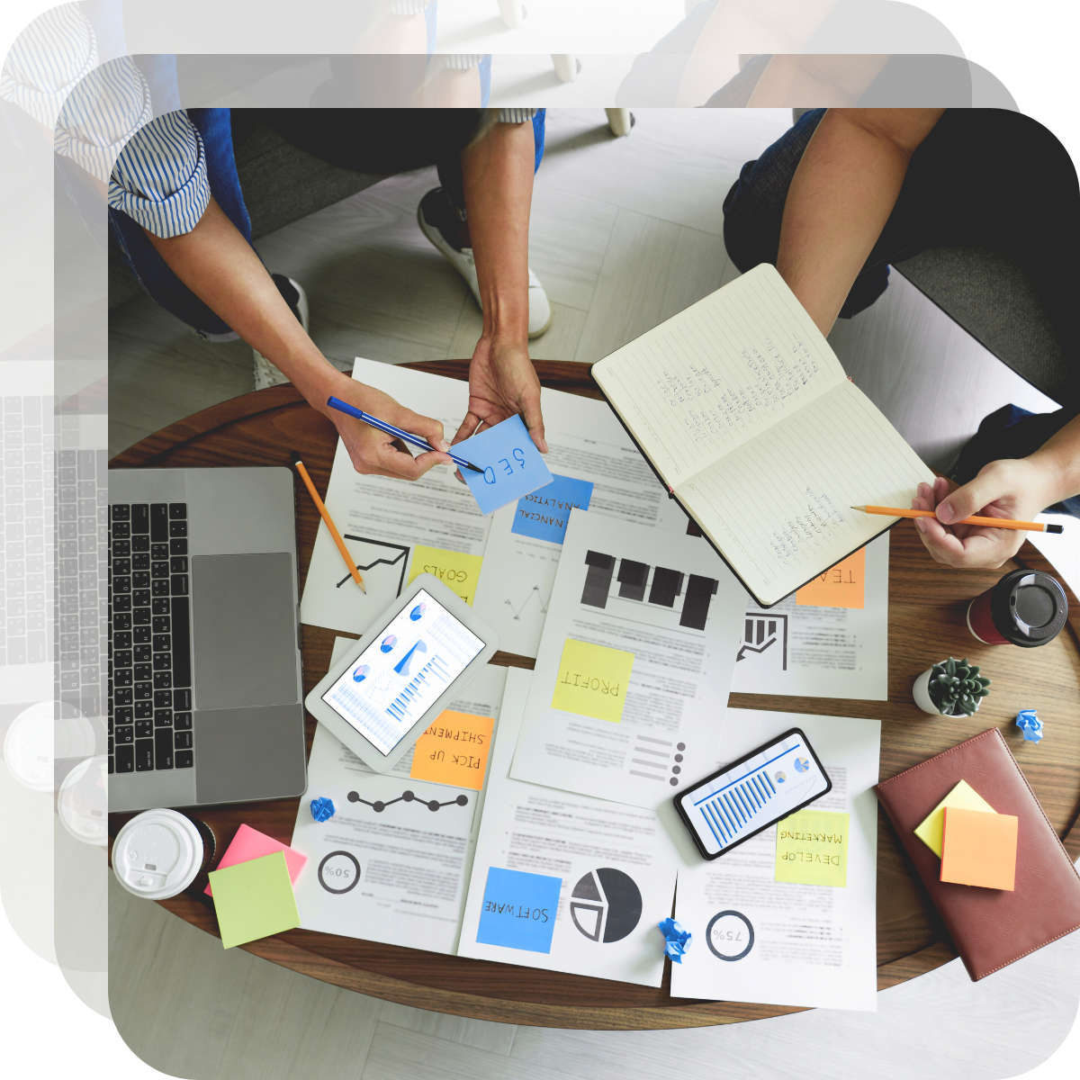 A photograph of a team of sales professionals working with a fractional sales leader.